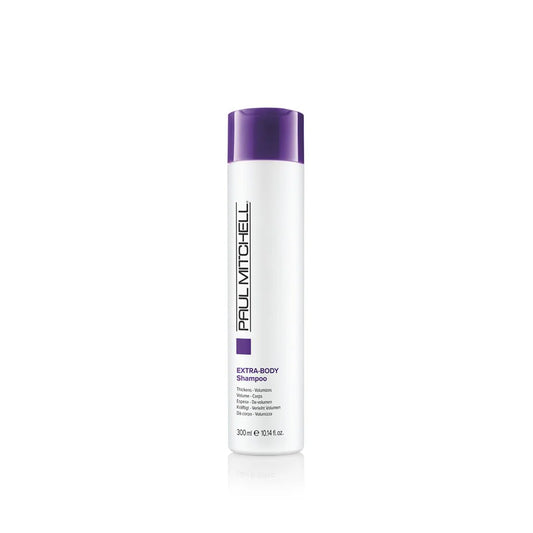 Extra Body Shampoo Volumen Shampoo für feines Haar, weiße Produktflasche mit violettem Akzent vor hellem Hintergrund, Paul Mitchell
